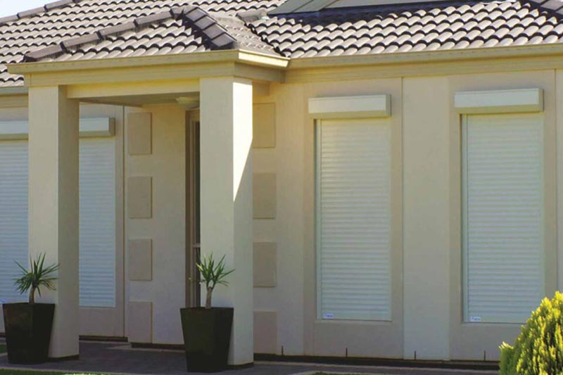 Battery roller shutters on modern home