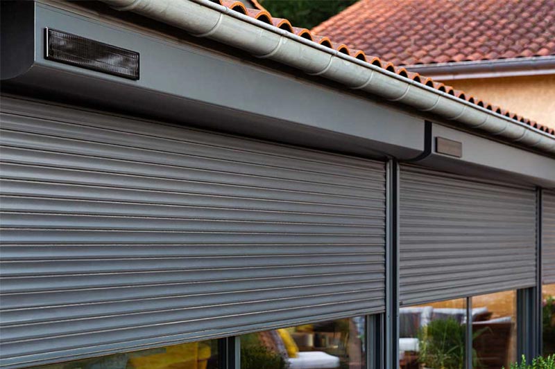 Solar roller shutters on modern home